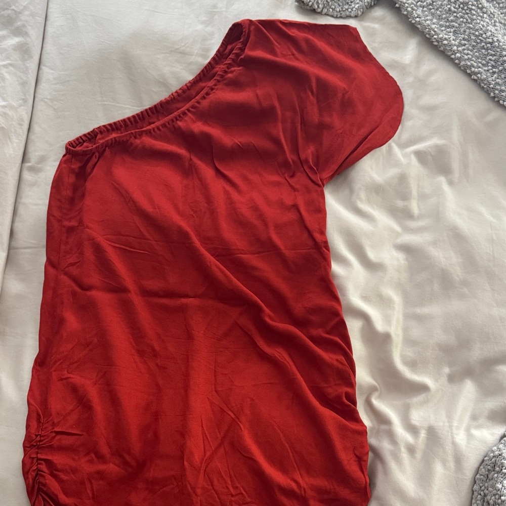 Indah Vibrant burnt orange red one shoulder dress.